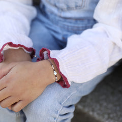 LIS - pulsera cruz con bolitas