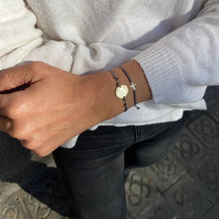 TRIANA - pulsera cruz dorada 7x10mm