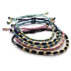 ADA DOR - pulsera bolitas doradas