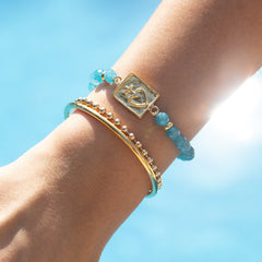 DETENTE DOR - pulsera personalizable dorada piedras azules