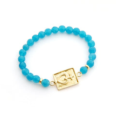 DETENTE DOR - pulsera personalizable dorada piedras azules
